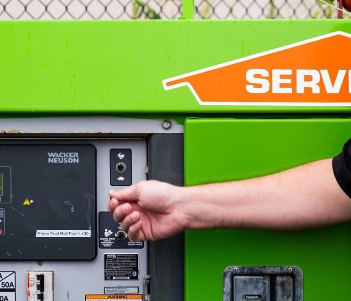 SERVPRO expert turning on switch